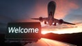 Welcome Green Road Sign and Airplane Above with Dramatic Blue Sky and Clouds Royalty Free Stock Photo