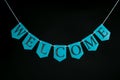 Welcome home banner. Greeting letters hanging on welcoming bunting