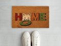 Welcome Home Coir entry designer doormat with white sneaker shoes