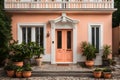 Welcome Home: Elegant House Frontage with a Peach Door and White Wooden Charm