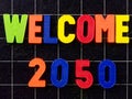 Welcome 2050 Magnetic colorful letters on blackboard chalkboard Royalty Free Stock Photo