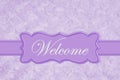 Welcome message on a pale purple rose plush fabric with ribbon