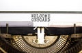 Welcome onboard and support symbol. Concept words Welcome onboard on white paper typed on retro typewriter. Beautiful white Royalty Free Stock Photo