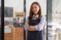 Welcome open shop barista waitress open sign on glass door modern coffee shop ready to serve restaurant cafe retail Royalty Free Stock Photo