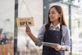 Welcome open shop barista waitress open sign on glass door modern coffee shop ready to serve restaurant cafe retail Royalty Free Stock Photo