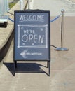 Welcome open sign, restaurant or shop ready to service after corona lockdown,billboard, sandwich board in