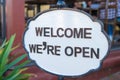 Welcome we are open sign at restaurant entrance Royalty Free Stock Photo