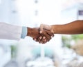 Welcome, please take a seat. Cropped shot of an unrecognizable doctor and patient shaking hands while standing in the