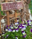 Welcome sign and flowers