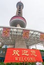 Welcome sign in front of Oriental Pearl TV tower, Shanghai, China