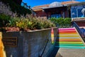 Welcome sign for Ghirardelli Square and vibrant colorful staircase leading up to square