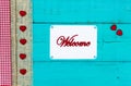 Welcome sign with hearts hanging on door Royalty Free Stock Photo