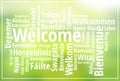 Welcome sign in multiple languages on natural green blurry background Royalty Free Stock Photo