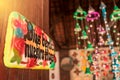 Welcome sign that says in Spanish: God bless our home. The clay ornament hangs on the door of a craft store in La Paz Centro Royalty Free Stock Photo