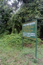 Welcome sign to Bwindi Impenetrable National Park, Southern Sector at Rushaga Gate, noting the gorilla families found on treks
