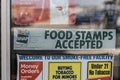 We Welcome SNAP Benefits sign. SNAP and Food Stamps provide nutrition benefits to assist disadvantaged families Royalty Free Stock Photo