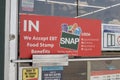 We Welcome SNAP Benefits sign. SNAP and Food Stamps provide nutrition benefits to assist disadvantaged families Royalty Free Stock Photo