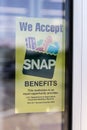 We Welcome SNAP Benefits sign. SNAP and Food Stamps provide nutrition benefits to assist disadvantaged families Royalty Free Stock Photo