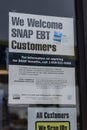We Welcome SNAP EBT Customers sign. SNAP and Food Stamps provide nutrition benefits to assist disadvantaged families
