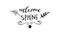 Welcome Spring headline. Decorated with twigs, flower splashes. Hand drawn calligraphy title text.