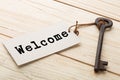Welcome - tag on vintage key, check-in hotel concept Royalty Free Stock Photo