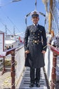 Welcome on tallship ARM CuauhtÃÂ©moc by this sailor with its beautiful uniform in the harbour of Scheveningen