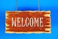 Welcome. Text caption on the background of a vintage sign banner.