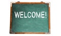Welcome! text message in white chalk written on a school green old grungy vintage wooden chalkboard or blackboard Royalty Free Stock Photo