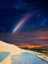 Fantastic unreal image: giant colorful comet in dark starry sky over white Pamukkale, Turkey