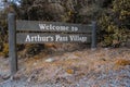 Welcome to Arthur`s Pass Village sign, wooden street sign, in Arthur`s Pass, Canterbury, New Zealand