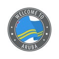 Welcome to Aruba. Gray stamp with a waving country flag.
