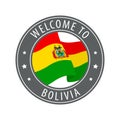 Welcome to Bolivia. Gray stamp with a waving country flag.