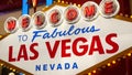 Welcome to fabulous Las Vegas retro neon sign in gambling tourist resort, USA. Iconic vintage glowing banner, symbol of casino,