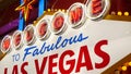 Welcome to fabulous Las Vegas retro neon sign in gambling tourist resort, USA. Iconic vintage glowing banner, symbol of casino,