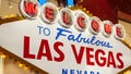 Welcome to fabulous Las Vegas retro neon sign in gambling tourist resort, USA. Iconic vintage glowing banner, symbol of casino, Royalty Free Stock Photo