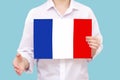 Welcome to France, population migration. World. Man holding out his hand on a blue background Royalty Free Stock Photo
