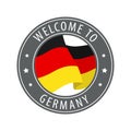 Welcome to Germany. Gray stamp with a waving country flag