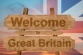 Welcome to Great Britain sing on wood background with blending national flag