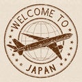 Welcome to Japan. Brown travel stamp on beige background
