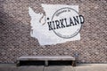 Welcome to Kirkland sign on the exterior brick wall of a building