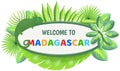 Welcome to madagascar banner with hand written word, funny animal chameleon, flowers and leaves