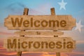 Welcome to Micronesia sign on wood background with blending nationa Royalty Free Stock Photo