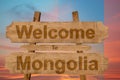 Welcome to Mongolia sign on wood background with blending nationa Royalty Free Stock Photo