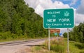 The Welcome to New York state line sign on US Route 62 in Chautauqua County, New York, USA