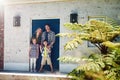 Welcome to our happy home. Portrait of a happy family standing outside their home. Royalty Free Stock Photo