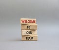 Welcome to our team symbol. Concept words Welcome to our team on wooden blocks. Beautiful grey background. Business and Welcome to Royalty Free Stock Photo