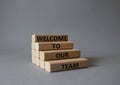 Welcome to our team symbol. Concept words Welcome to our team on wooden blocks. Beautiful grey background. Business and Welcome to Royalty Free Stock Photo