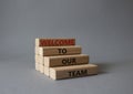 Welcome to our team symbol. Concept words Welcome to our team on wooden blocks. Beautiful grey background. Business and Welcome to Royalty Free Stock Photo