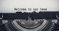 Welcome to our team text typed on an old vintage typewriter. Team work concept Royalty Free Stock Photo