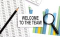 WELCOME TO OUR TEAM text on white card on chart background Royalty Free Stock Photo